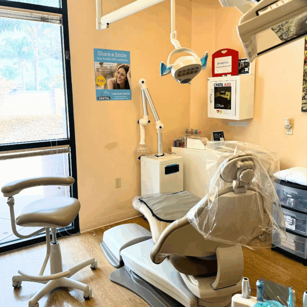 Modern dental exam room with chair and equipment